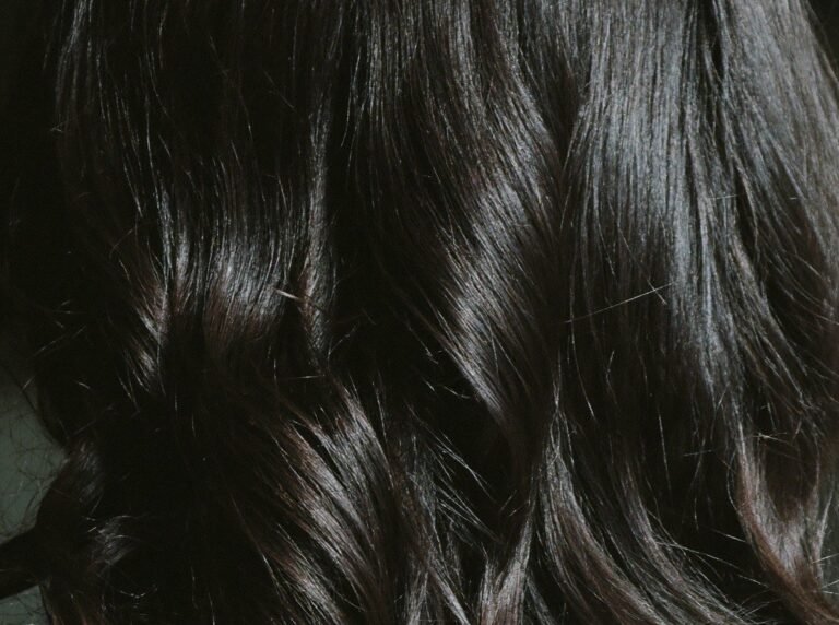 Close-up of glossy natural black hair after herbal colouring